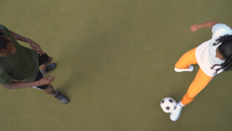 Overhead-Shot-Of-Male-And-Female-Soccer-Players-Practising-Passing-Football-1