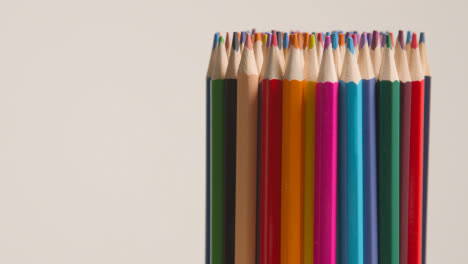 Studio-Shot-Of-Multi-Coloured-Pencils-Against-White-Background-