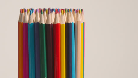 Studio-Shot-Of-Multi-Coloured-Pencils-Rotating-Against-White-Background-2