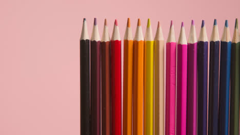 Studio-Shot-Of-Multi-Coloured-Pencils-Against-Pink-Background-1