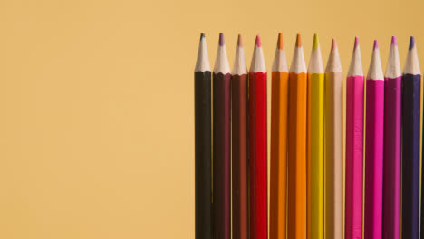 Studio-Shot-Of-Multi-Coloured-Pencils-Against-Yellow-Background-5