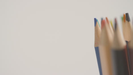 Studio-Shot-Of-Rotating-Multi-Coloured-Pencils-Against-White-Background-3