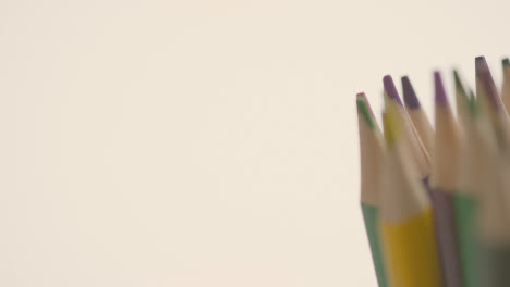 Studio-Shot-Of-Rotating-Multi-Coloured-Pencils-Against-Grey-Background-3