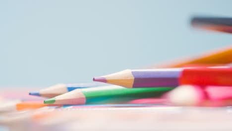 Close-Up-Shot-Of-Randomly-Arranged-Rotating-Multi-Coloured-Pencils-
