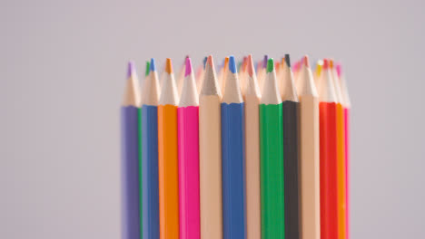 Studio-Shot-Of-Rotating-Multi-Coloured-Pencils-Against-Grey-Background-4