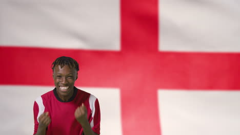 Young-Footballer-Celebrating-to-Camera-In-Front-of-England-Flag-01