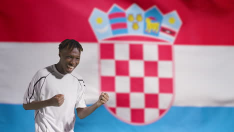 Young-Footballer-Celebrating-to-Camera-In-Front-of-Croatia-Flag-02