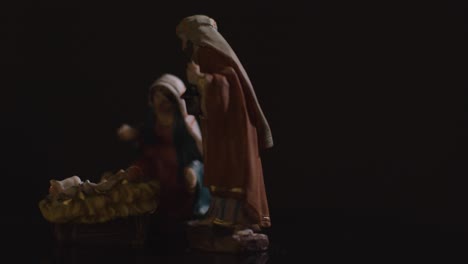 Studio-Christmas-Scene-With-Figures-Of-Mary-Joseph-And-Baby-Jesus-In-Manger-From-Nativity-