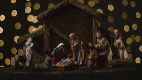 Studio-Christmas-Concept-Of-Baby-Jesus-In-Manger-With-Figures-From-Nativity-Scene-With-Lights-3