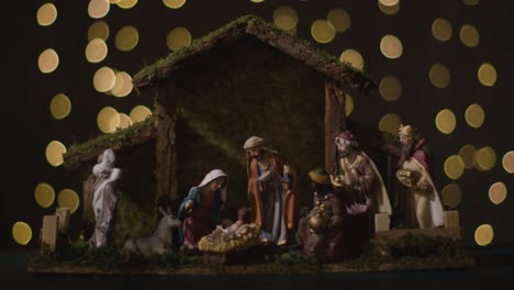 Studio-Christmas-Concept-Of-Baby-Jesus-In-Manger-With-Figures-From-Nativity-Scene-With-Lights-4