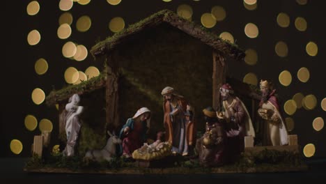 Studio-Christmas-Concept-Of-Baby-Jesus-In-Manger-With-Figures-From-Nativity-Scene-With-Lights-5