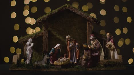 Studio-Christmas-Concept-Of-Baby-Jesus-In-Manger-With-Figures-From-Nativity-Scene-With-Lights-6