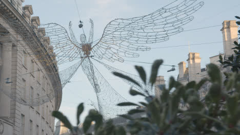 Close-Up-Of-Angel-Christmas-Light-Decoration-Across-Shops-On-London-UK-Regent-Street-2