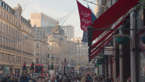 Shoppers-On-London-UK-Regent-Street-Decorated-For-Christmas-Outside-Hamley's-Toy-Store-In-Daytime-2