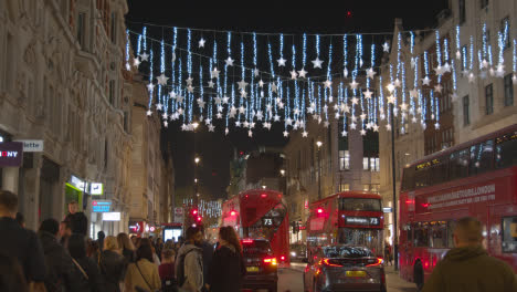 Christmas-Light-Decorations-Across-Shops-On-London-UK-Street-At-Night-1