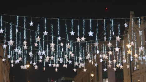 Defocused-Christmas-Light-Decorations-Across-Shops-On-London-UK-Street-At-Night-2