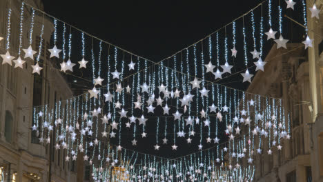 Christmas-Light-Decorations-Across-Shops-On-London-UK-Street-At-Night-3