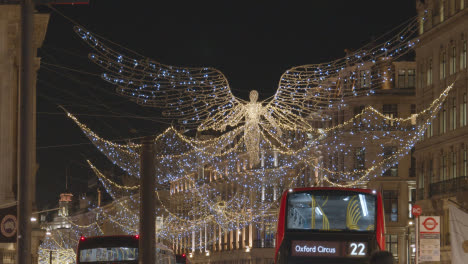 Close-Up-Of-Angel-Christmas-Light-Decoration-Across-Shops-On-London-UK-Regent-Street-At-Night