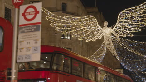Close-Up-Of-Angel-Christmas-Light-Decoration-Across-Shops-On-London-UK-Regent-Street-At-Night-2
