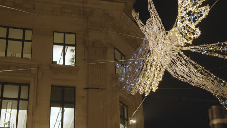 Close-Up-Of-Angel-Christmas-Light-Decoration-Across-Shops-On-London-UK-Regent-Street-At-Night-4