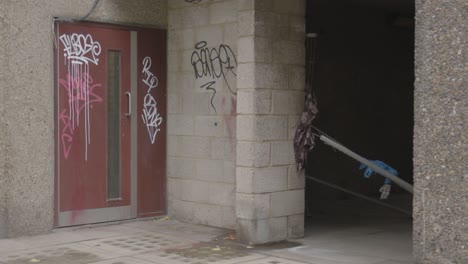 Entrance-Door-To-Inner-City-Housing-Development-In-Tower-Hamlets-London-With-Graffiti