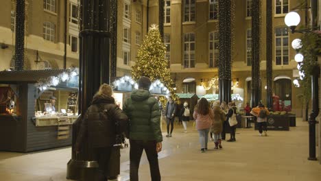 Busy-Christmas-Market-Stalls-In-Hayes-Galleria-On-London-South-Bank-At-Night