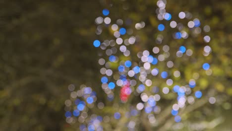 Defocused-Close-Up-Of-Trees-Decorated-With-Lights-For-Christmas-Along-South-Bank-In-London-At-Night