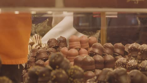 Close-Up-Of-Stall-Selling-Confectionery-At-Frankfurt-Christmas-Market-In-Birmingham-UK-At-Night