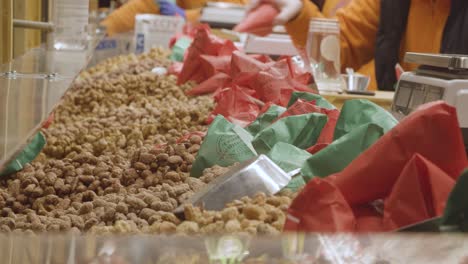 Close-Up-Of-Stall-Selling-Nuts-At-Frankfurt-Christmas-Market-In-Birmingham-UK-At-Night