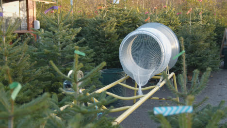 Machine-For-Netting-Christmas-Trees-Outdoors-At-Garden-Centre-5