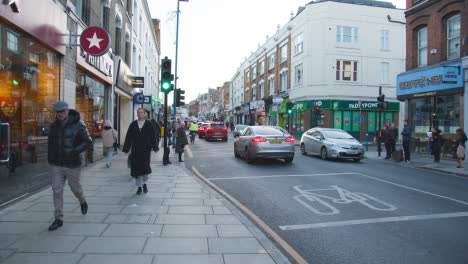 Shops-On-Putney-High-Street-London-Busy-With-Shoppers-And-Traffic-6