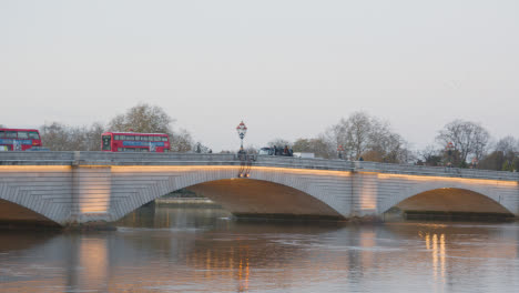 Putney-Bridge-Over-River-Thames-In-London-Illuminated-In-Winter-With-Buses-1