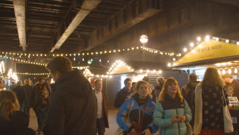 Busy-Christmas-Market-Stalls-On-London-South-Bank-At-Night