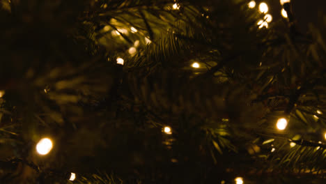 Close-Up-Of-Lights-And-Baubles-On-Christmas-Tree-1