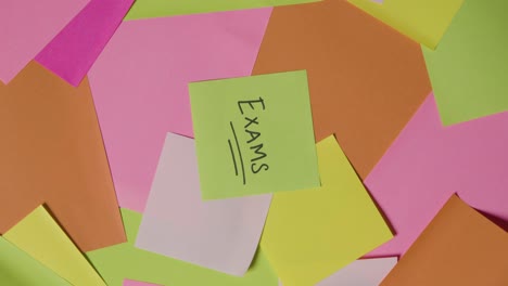 Education-Concept-Of-Revolving-Sticky-Notes-With-Exams-Written-On-Top-Note