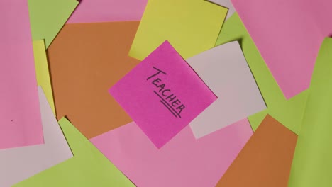 Education-Concept-Of-Revolving-Sticky-Notes-With-Teacher-Written-On-Top-Note
