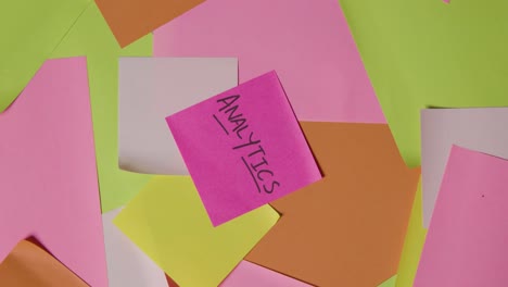 Business-Concept-Of-Revolving-Sticky-Notes-With-Analytics-Written-On-Top-Note