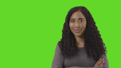 Portrait-Of-Woman-Against-Green-Screen-Smiling-At-Camera-4