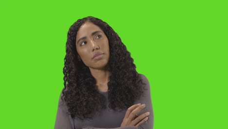 Frustrated-Woman-Looking-At-Mobile-Phone-Against-Green-Screen-1