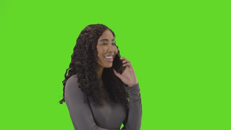 Frustrated-Woman-Talking-On-Mobile-Phone-Against-Green-Screen-Before-Hanging-Up