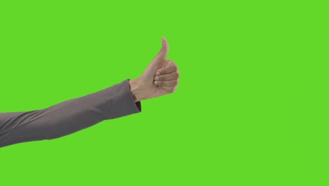 Studio-Close-Up-Shot-Of-Woman-Giving-Thumbs-Up-Sign-Against-Green-Screen-1