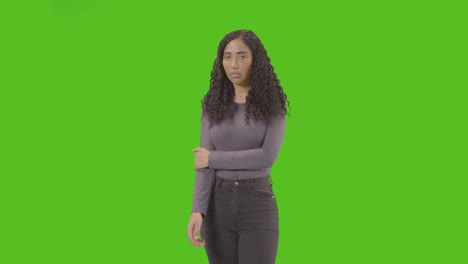 Three-Quarter-Length-Portrait-Of-Sad-Looking-Woman-Against-Green-Screen