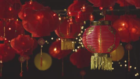 Studio-Shot-Of-Colourful-Chinese-Lanterns-Celebrating-New-Year-Hung-Against-Black-Background