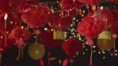 Studio-Shot-Of-Chinese-Lanterns-Celebrating-New-Year-With-Falling-Confetti-2