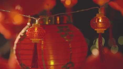 Close-Up-Of-Colourful-Chinese-Lanterns-And-Lights-Celebrating-New-Year-Hung-Against-Black-Background-1