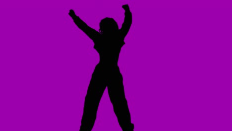 Studio-Silhouette-Of-Woman-Dancing-Against-Purple-Background