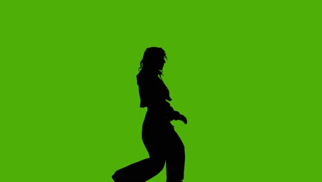 Studio-Silhouette-Of-Woman-Dancing-Against-Green-Background-3