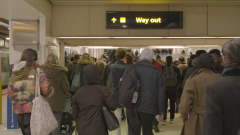 Commuter-Passengers-Getting-Off-UK-Train-At-London-Euston-Station