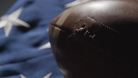 Close-Up-Studio-Shot-Of-American-Football-On-Stars-And-Stripes-Flag
