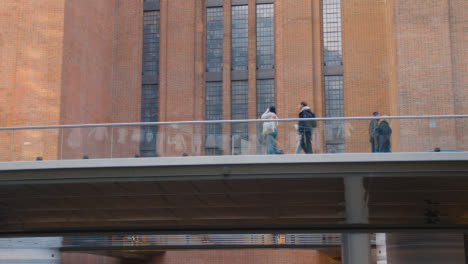 Visitors-Walking-On-Elevated-Section-At-Battersea-Power-Station-Development-In-London-UK